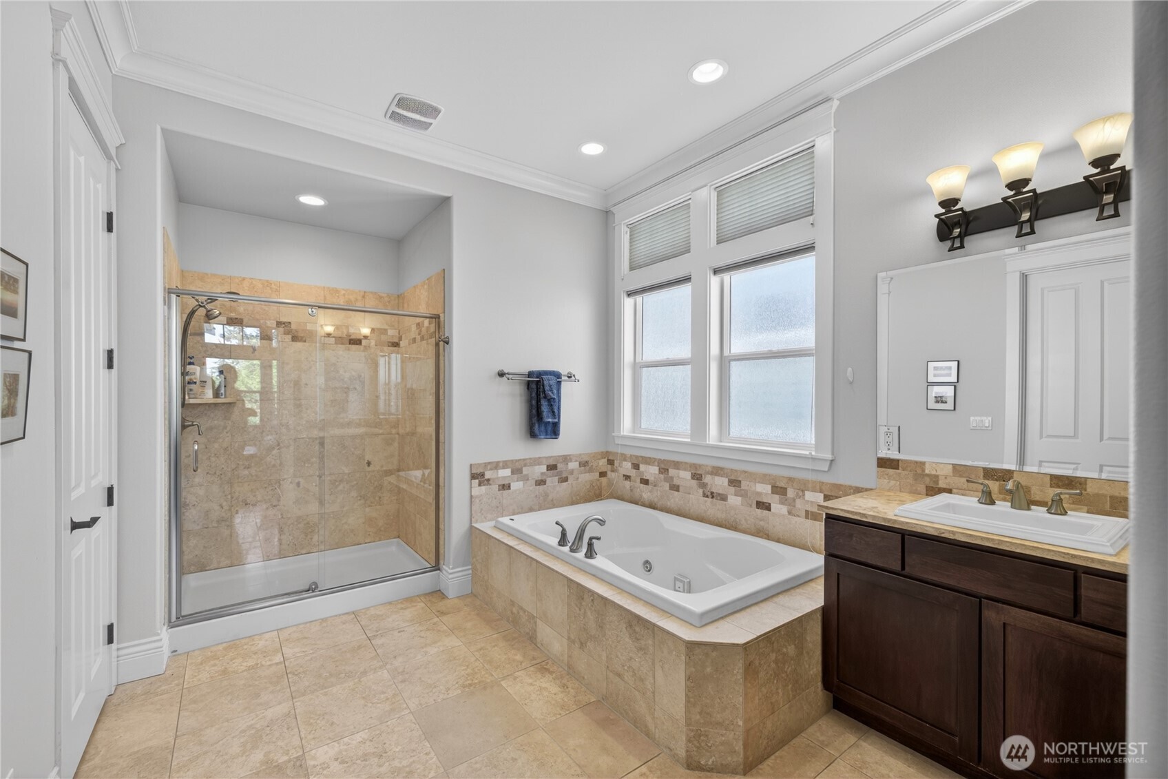 1908 29th Place Anacortes, WA 98221 - Photo 36 of 40 a bathroom with a sink a toilet a mirror and shower