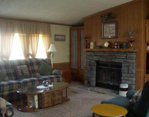 114 Rydle Road Mount Pleasant, PA 15666 - Photo 8 of 18 Great Room. BUILT INS AROUND STONE WOOD BURNING FIRE PLACE, ROOM FOR FLAT SCREEN TO RIGHT OF FIRE PLACE, GREAT ROOM AND KITCHEN ALL ONE