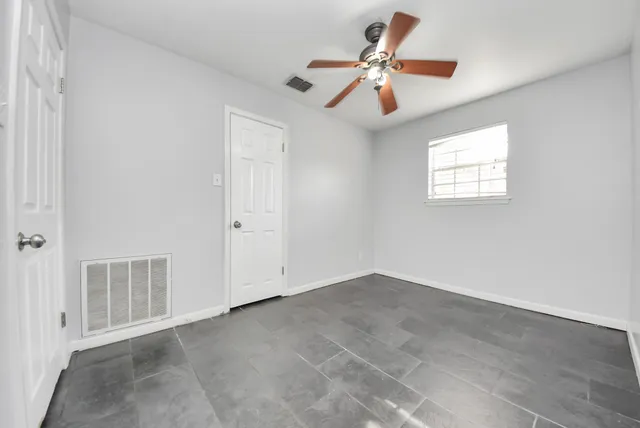 an empty room with fan