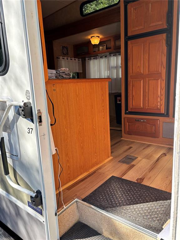 14348 Northeast 252nd Ct Road Fort McCoy, FL 32134 - Photo 11 of 51 a room with blue walls and railing