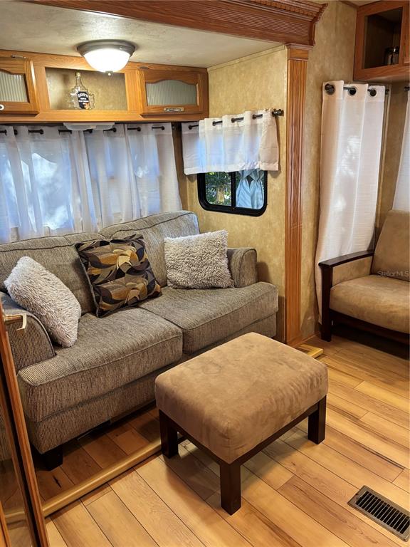 14348 Northeast 252nd Ct Road Fort McCoy, FL 32134 - Photo 14 of 51 a living room with furniture and a couch