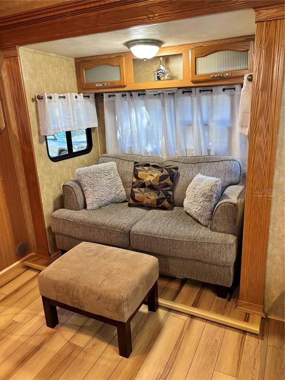 14348 Northeast 252nd Ct Road Fort McCoy, FL 32134 - Photo 15 of 51 a living room with furniture and a wooden floor