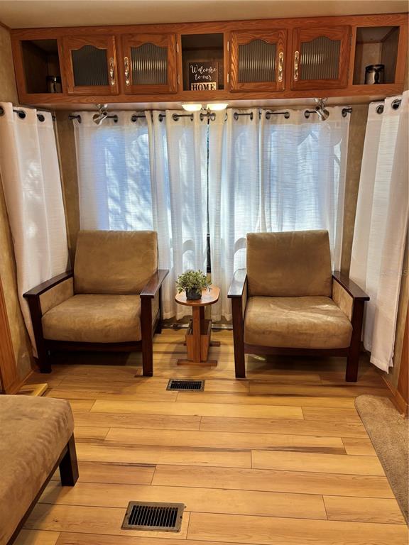 14348 Northeast 252nd Ct Road Fort McCoy, FL 32134 - Photo 16 of 51 a living room with furniture and a rug