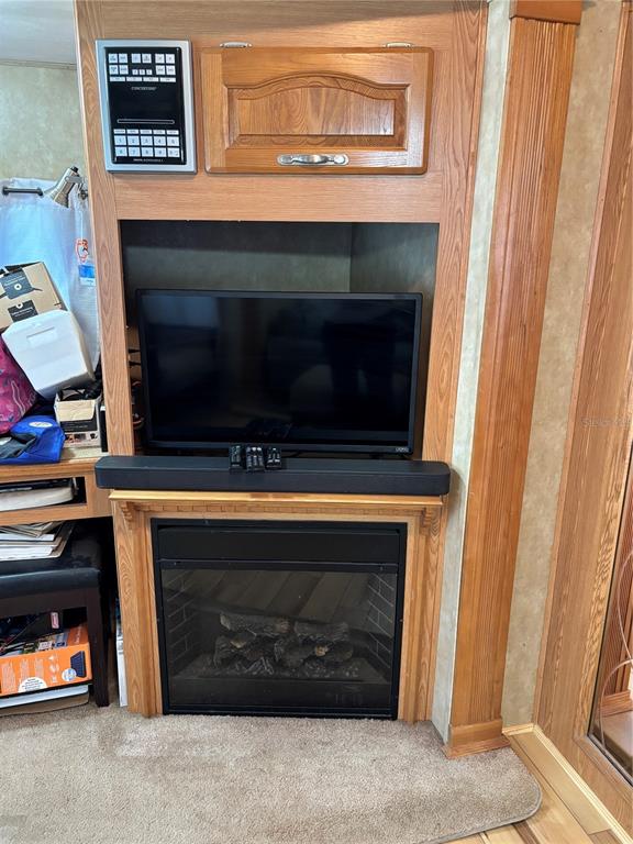 14348 Northeast 252nd Ct Road Fort McCoy, FL 32134 - Photo 17 of 51 a living room with a fireplace