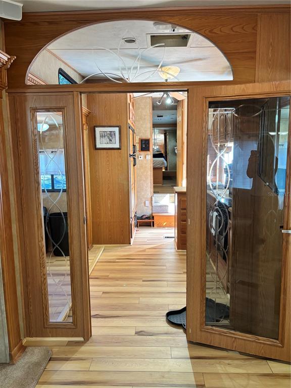14348 Northeast 252nd Ct Road Fort McCoy, FL 32134 - Photo 19 of 51 a view of a hallway with wooden floor and entryway