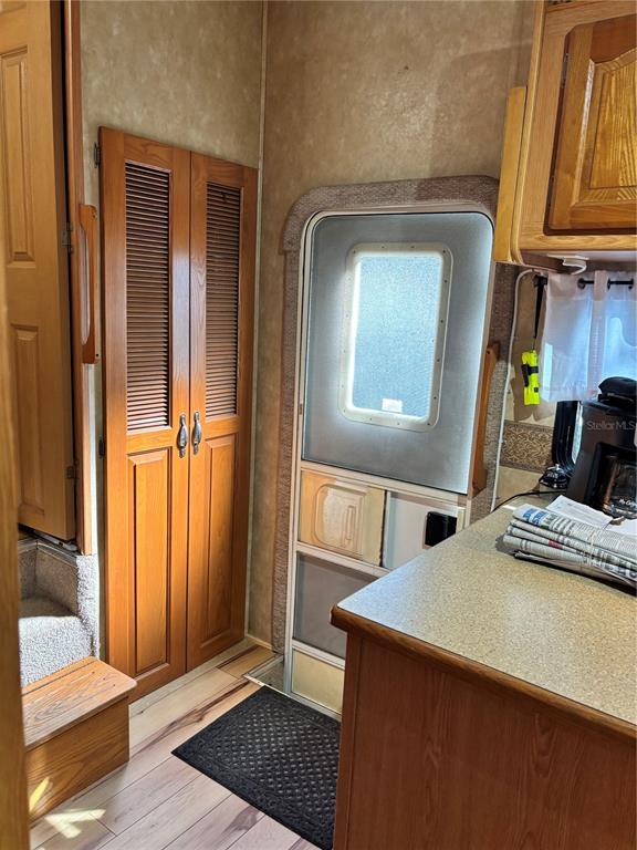 14348 Northeast 252nd Ct Road Fort McCoy, FL 32134 - Photo 26 of 51 a view of a hallway with wooden floor and staircase