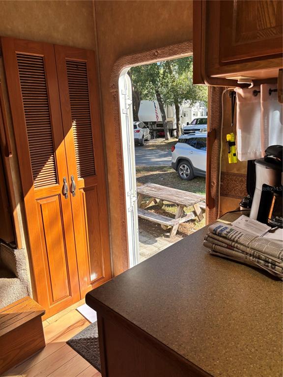 14348 Northeast 252nd Ct Road Fort McCoy, FL 32134 - Photo 28 of 51 a view of walk in closet with clothes and shoes