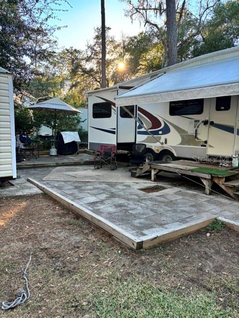 14348 Northeast 252nd Ct Road Fort McCoy, FL 32134 - Photo 3 of 51 a front view of a house with parking area