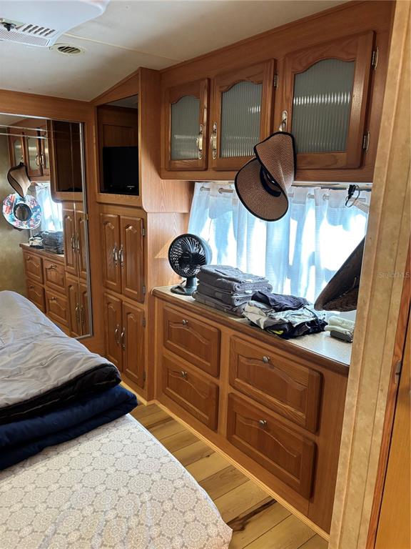 14348 Northeast 252nd Ct Road Fort McCoy, FL 32134 - Photo 31 of 51 a kitchen with a stove and a microwave