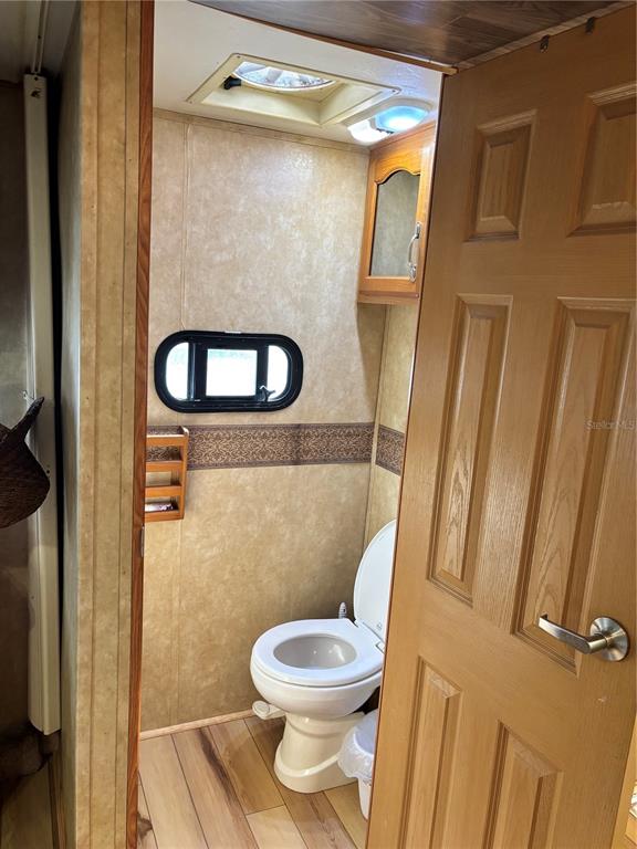 14348 Northeast 252nd Ct Road Fort McCoy, FL 32134 - Photo 36 of 51 a bathroom with a toilet and a shower