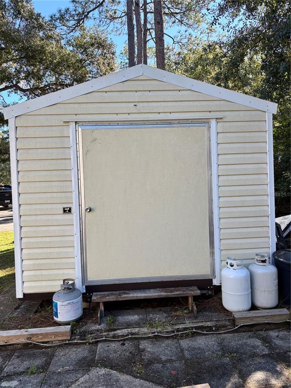 14348 Northeast 252nd Ct Road Fort McCoy, FL 32134 - Photo 39 of 51 a small white building