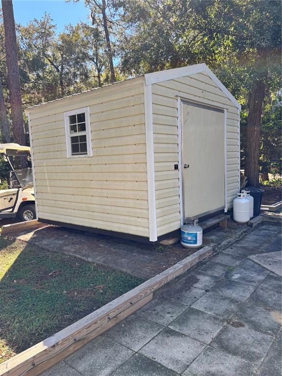 14348 Northeast 252nd Ct Road Fort McCoy, FL 32134 - Photo 40 of 51 a view of a house with a yard
