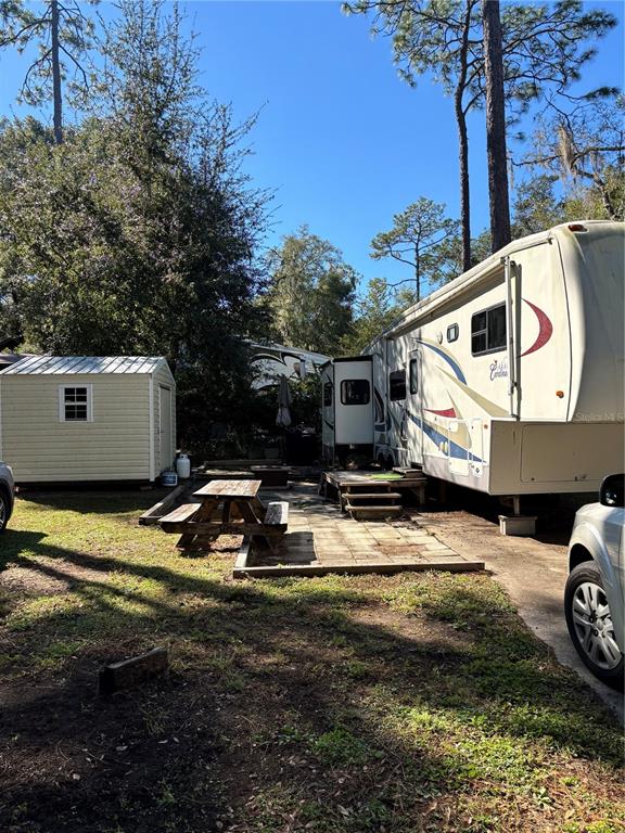 14348 Northeast 252nd Ct Road Fort McCoy, FL 32134 - Photo 6 of 51 a view of a back yard of the house