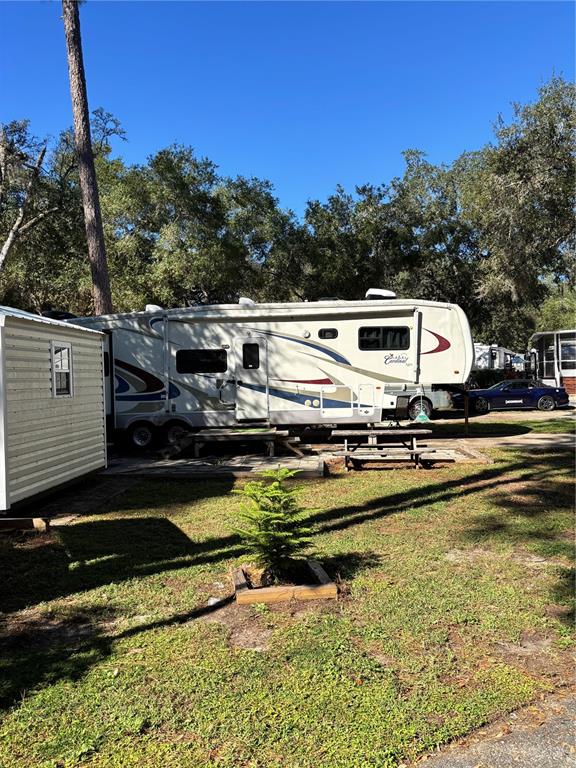 14348 Northeast 252nd Ct Road Fort McCoy, FL 32134 - Photo 7 of 51 a view of a house with swimming pool