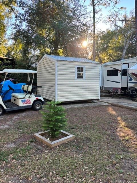 14348 Northeast 252nd Ct Road Fort McCoy, FL 32134 - Photo 10 of 51 a front view of a house with garden