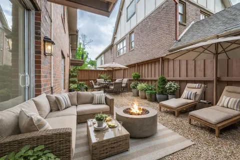 a view of a patio with couches and a potted plant