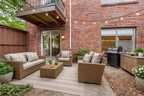 a outdoor living space with furniture and a potted plant