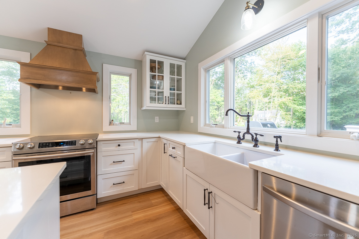 147 Pequot Avenue Groton, CT 06355 - Photo 15 of 39 a kitchen with a sink stove top oven and cabinets