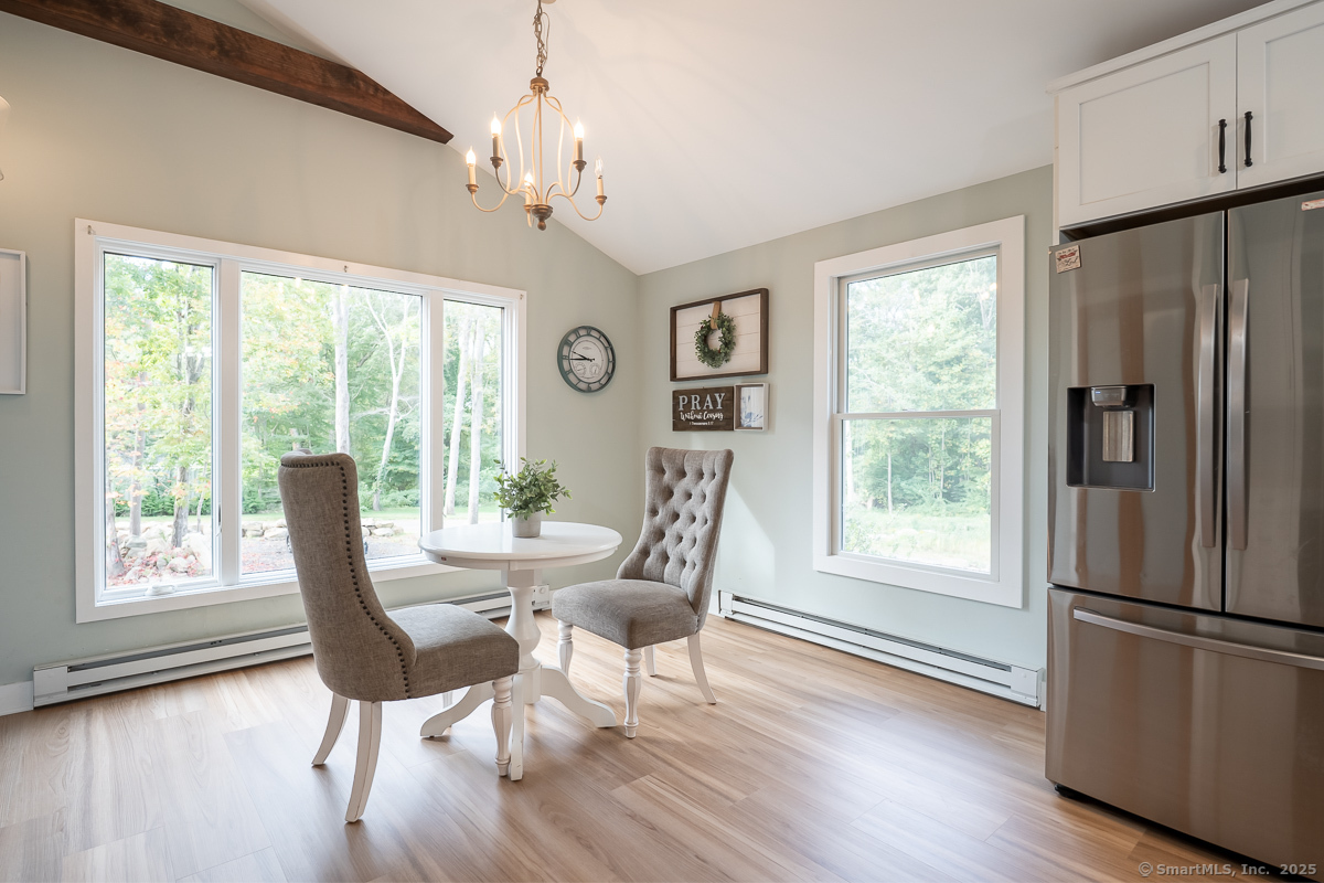 147 Pequot Avenue Groton, CT 06355 - Photo 21 of 39 a view of a dining room with furniture window and wooden floor