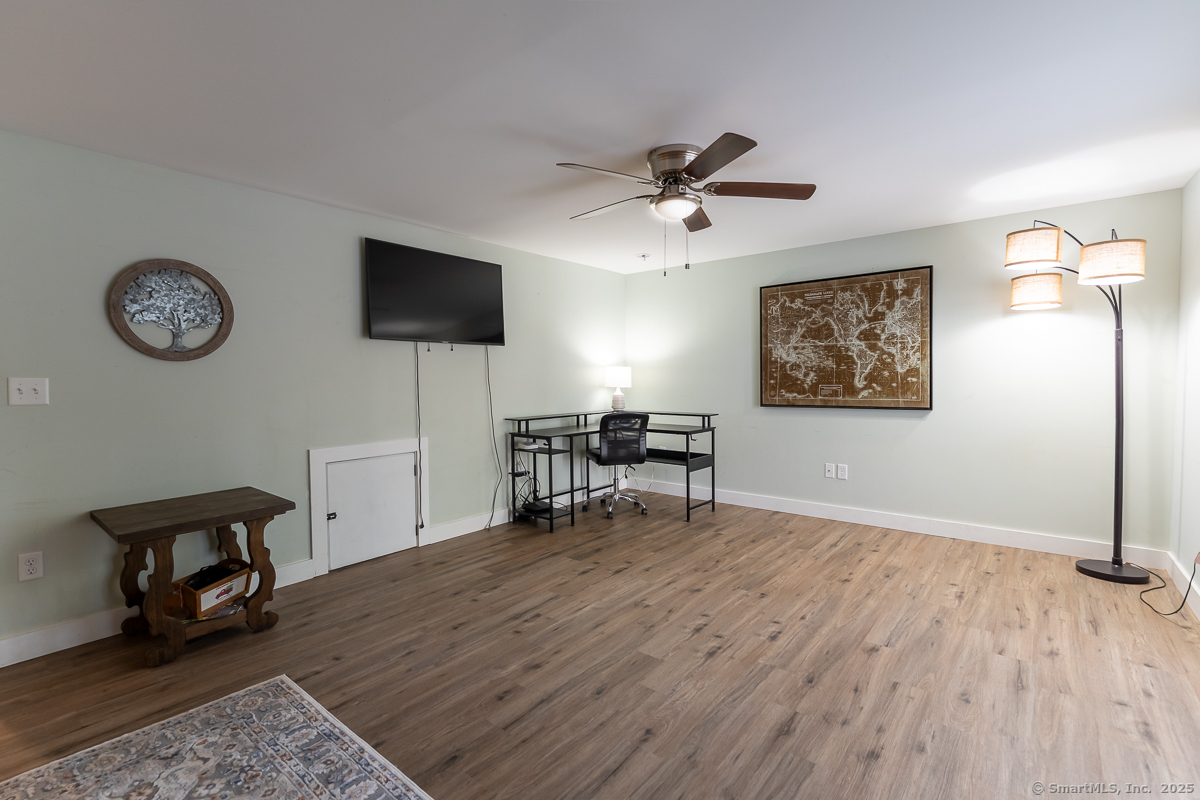 147 Pequot Avenue Groton, CT 06355 - Photo 31 of 39 a view of a livingroom with furniture and a flat screen tv