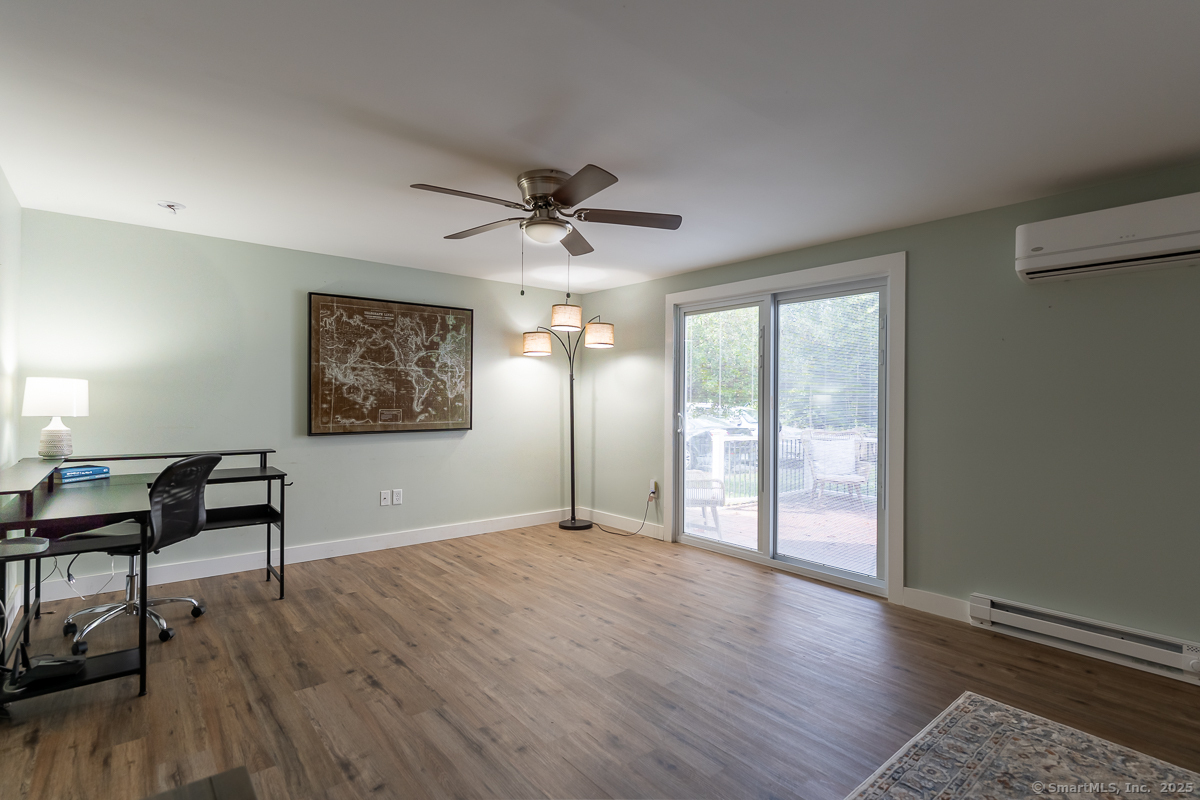 147 Pequot Avenue Groton, CT 06355 - Photo 33 of 39 a view of a big room with wooden floor and windows