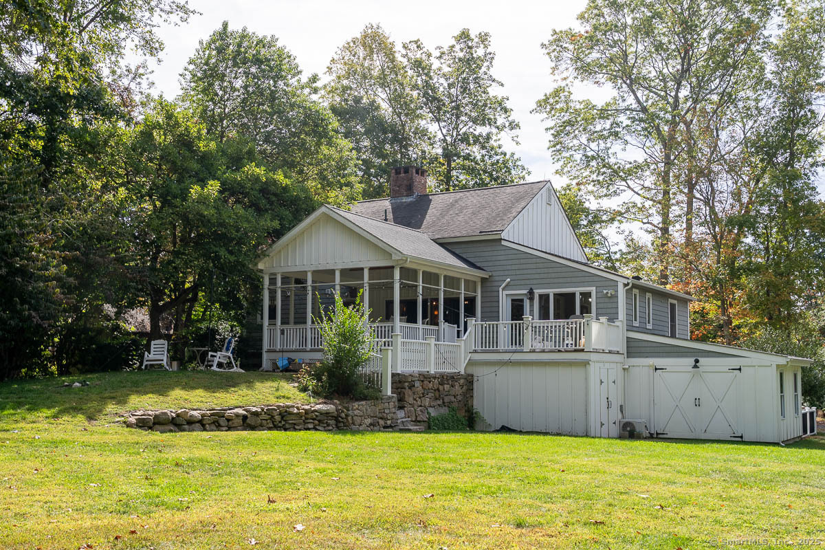 147 Pequot Avenue Groton, CT 06355 - Photo 37 of 39 a front view of a house with a yard and garage
