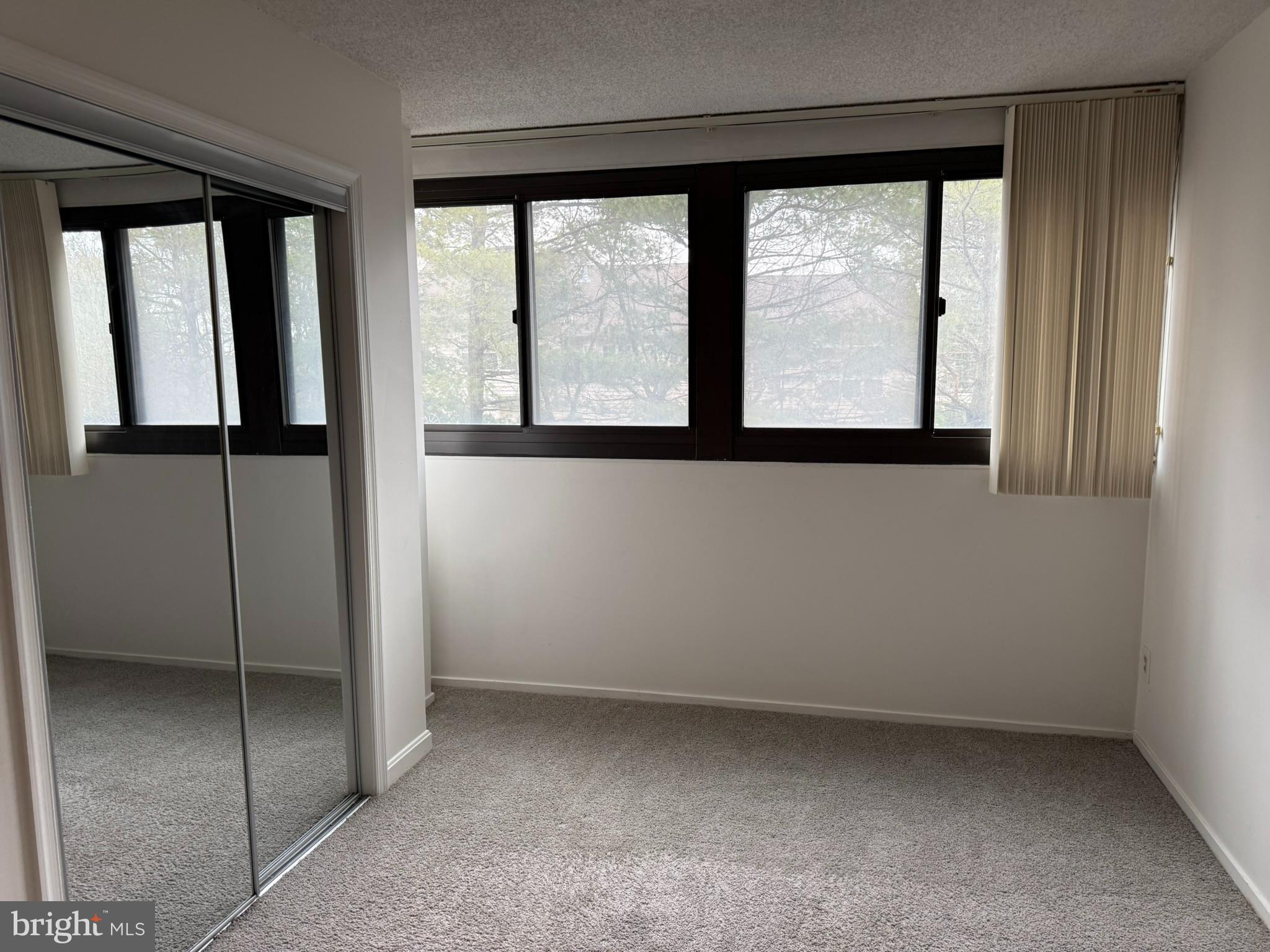 5911 Edsall Road, Unit 601 Alexandria, VA 22304 - Photo 11 of 14 a view of an empty room with a window