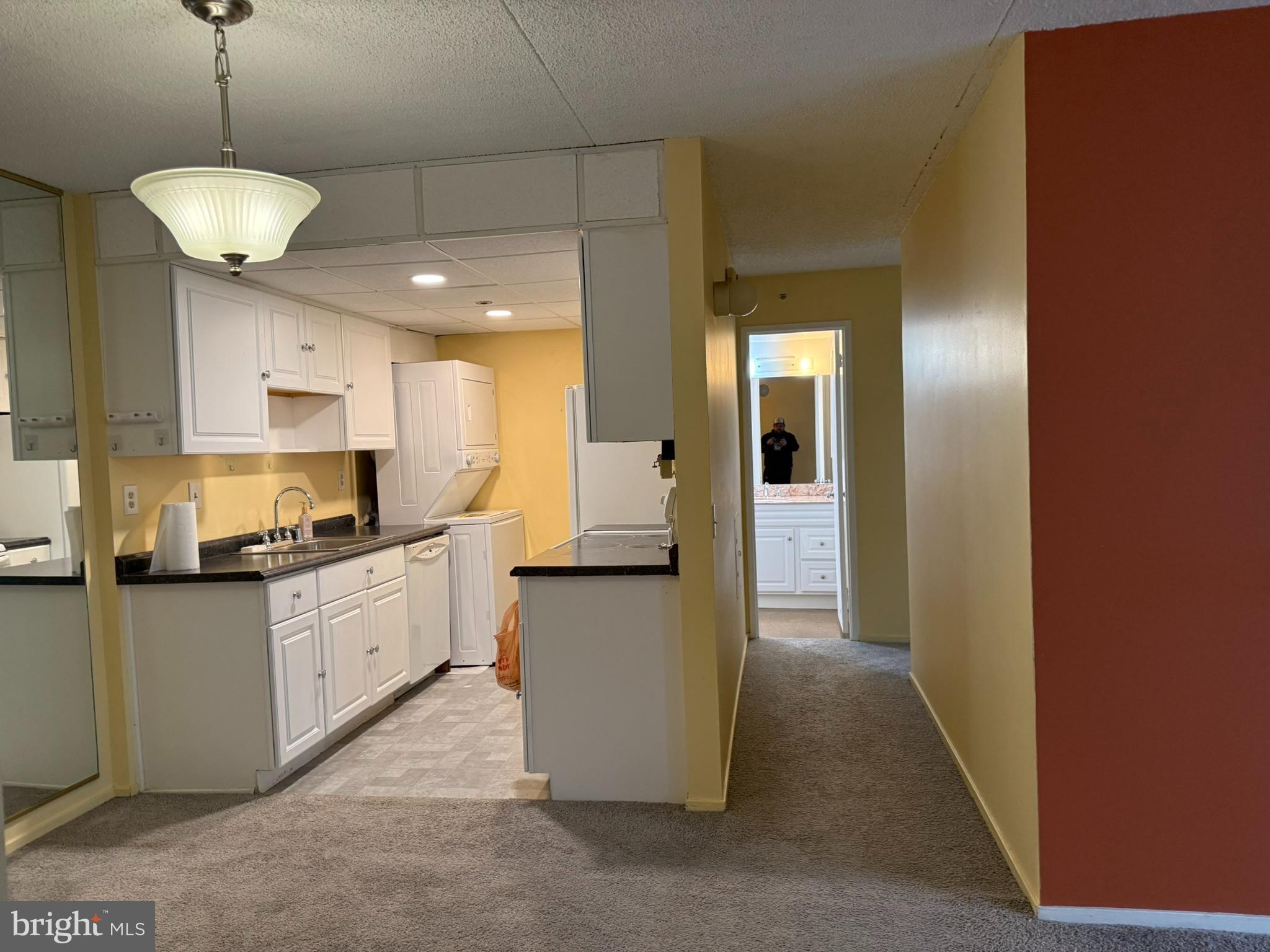 5911 Edsall Road, Unit 601 Alexandria, VA 22304 - Photo 5 of 14 a large kitchen with cabinets and wooden floor
