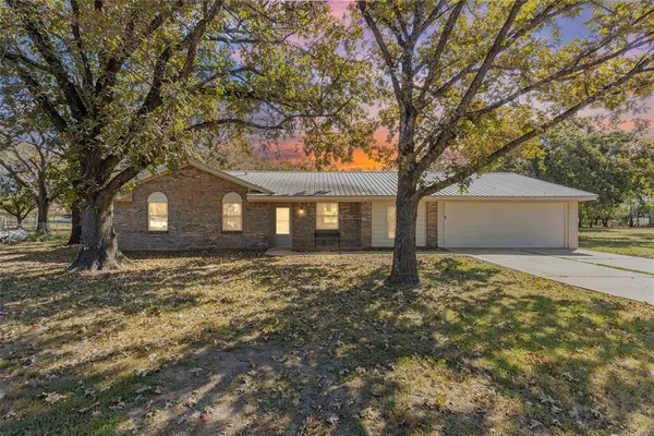 a house with trees in front of it