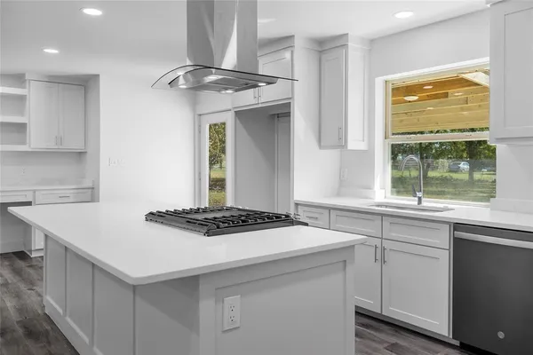 a kitchen with a stove and a sink