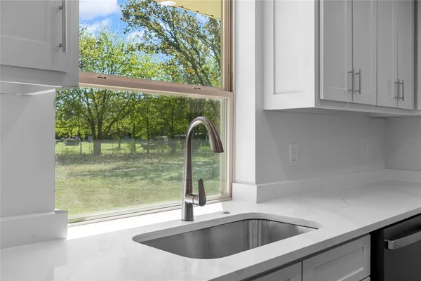 a view of a sink and a window