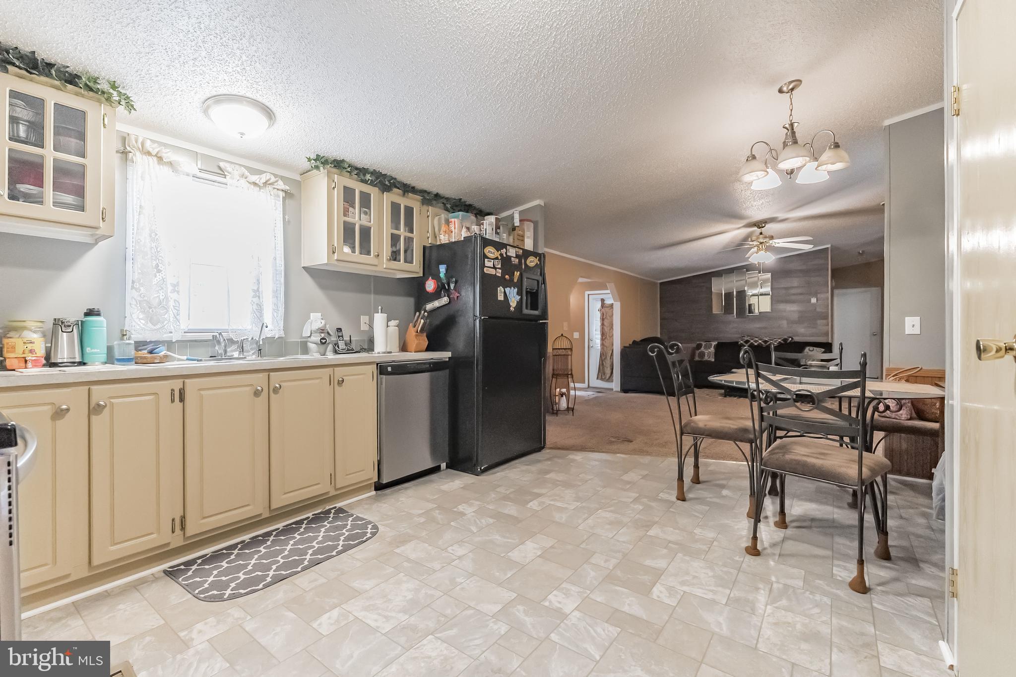 2705 Port Tobacco Road Nanjemoy, MD 20662 - Photo 13 of 14 a kitchen with cabinets and chairs