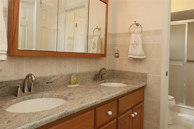 a bathroom with a glass shower door