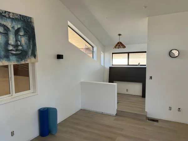 a room with furniture and a wooden floor