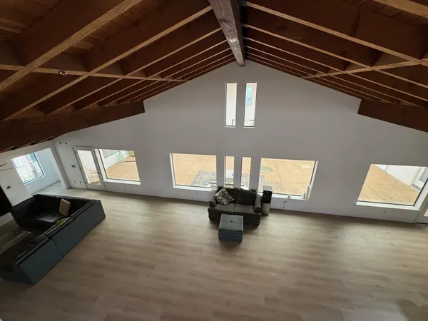 a view of living room with furniture and fireplace