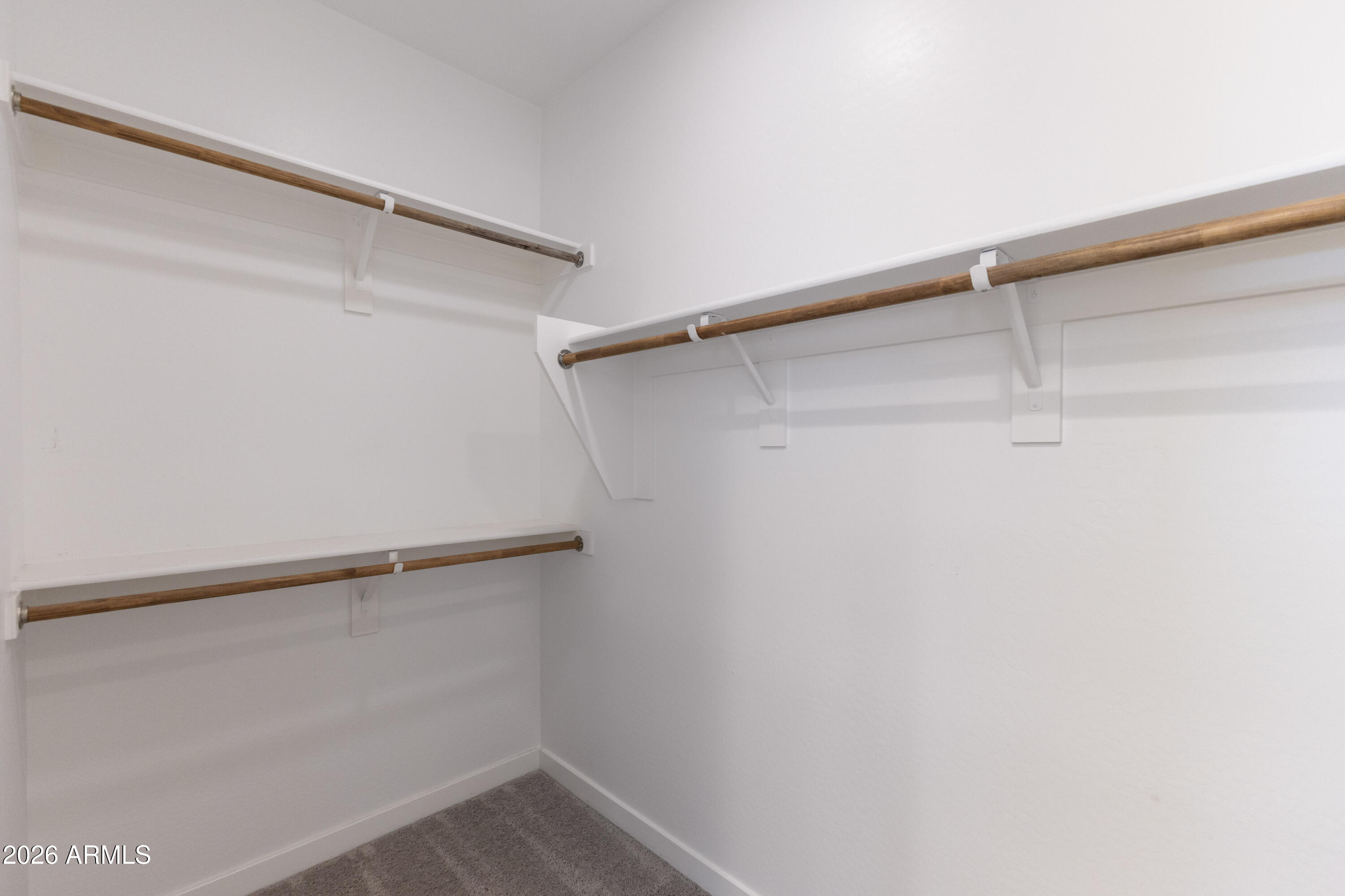 21303 East Estrella Road Queen Creek, AZ 85142 - Photo 20 of 32 a view of an empty walk in closet