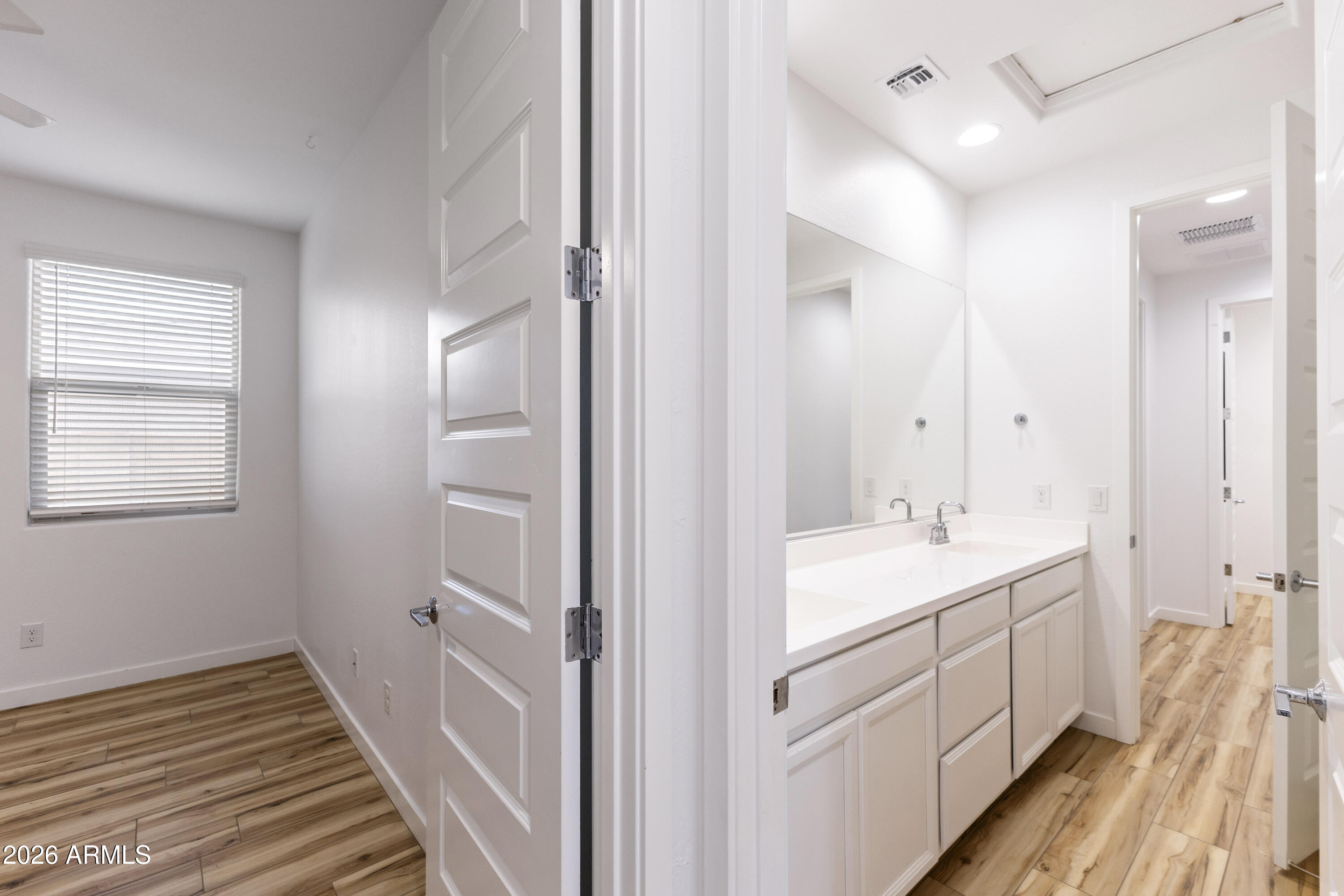 21303 East Estrella Road Queen Creek, AZ 85142 - Photo 21 of 32 a spacious bathroom with a double vanity sink a mirror and a shower