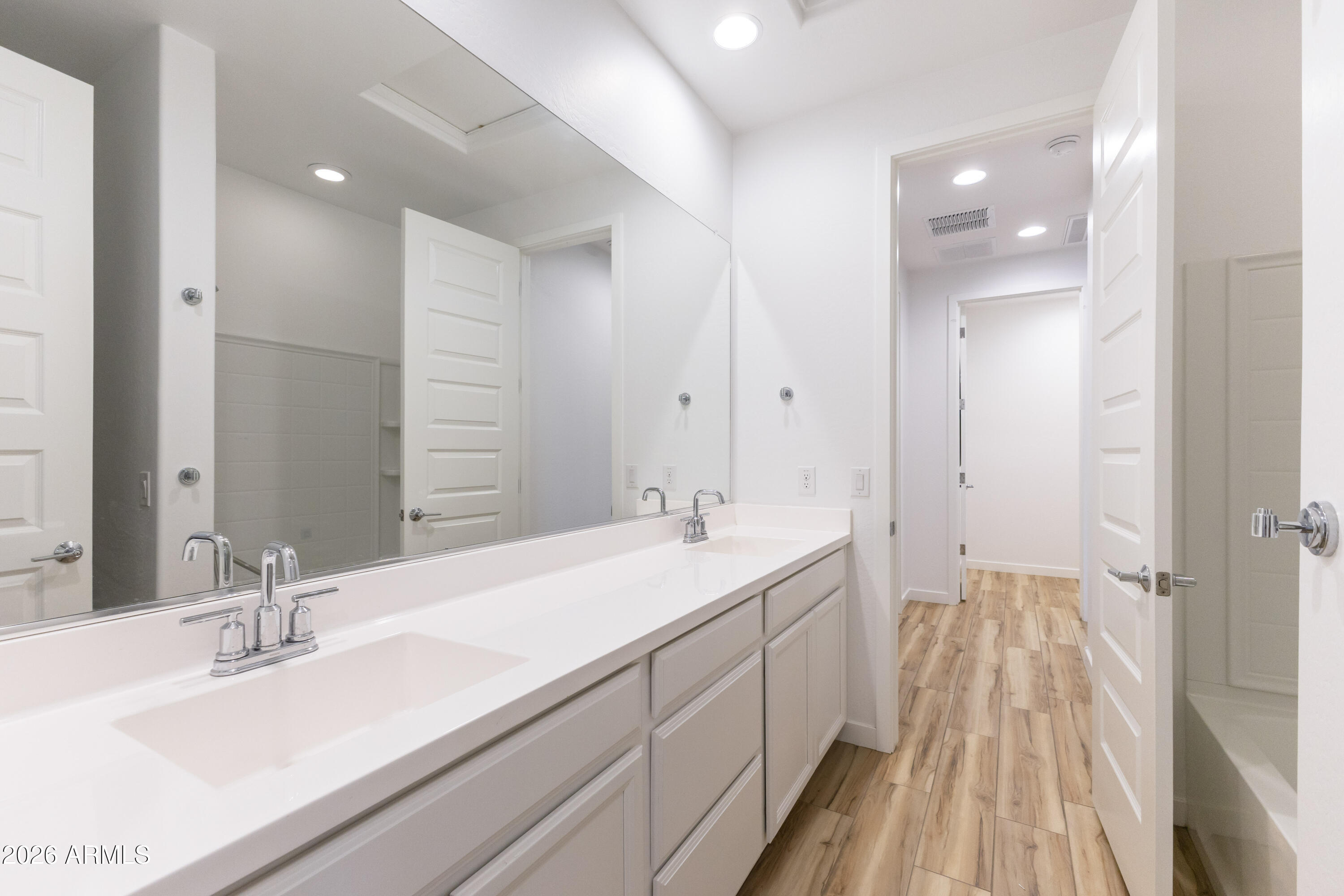 21303 East Estrella Road Queen Creek, AZ 85142 - Photo 23 of 32 a bathroom with a double vanity sink and a mirror