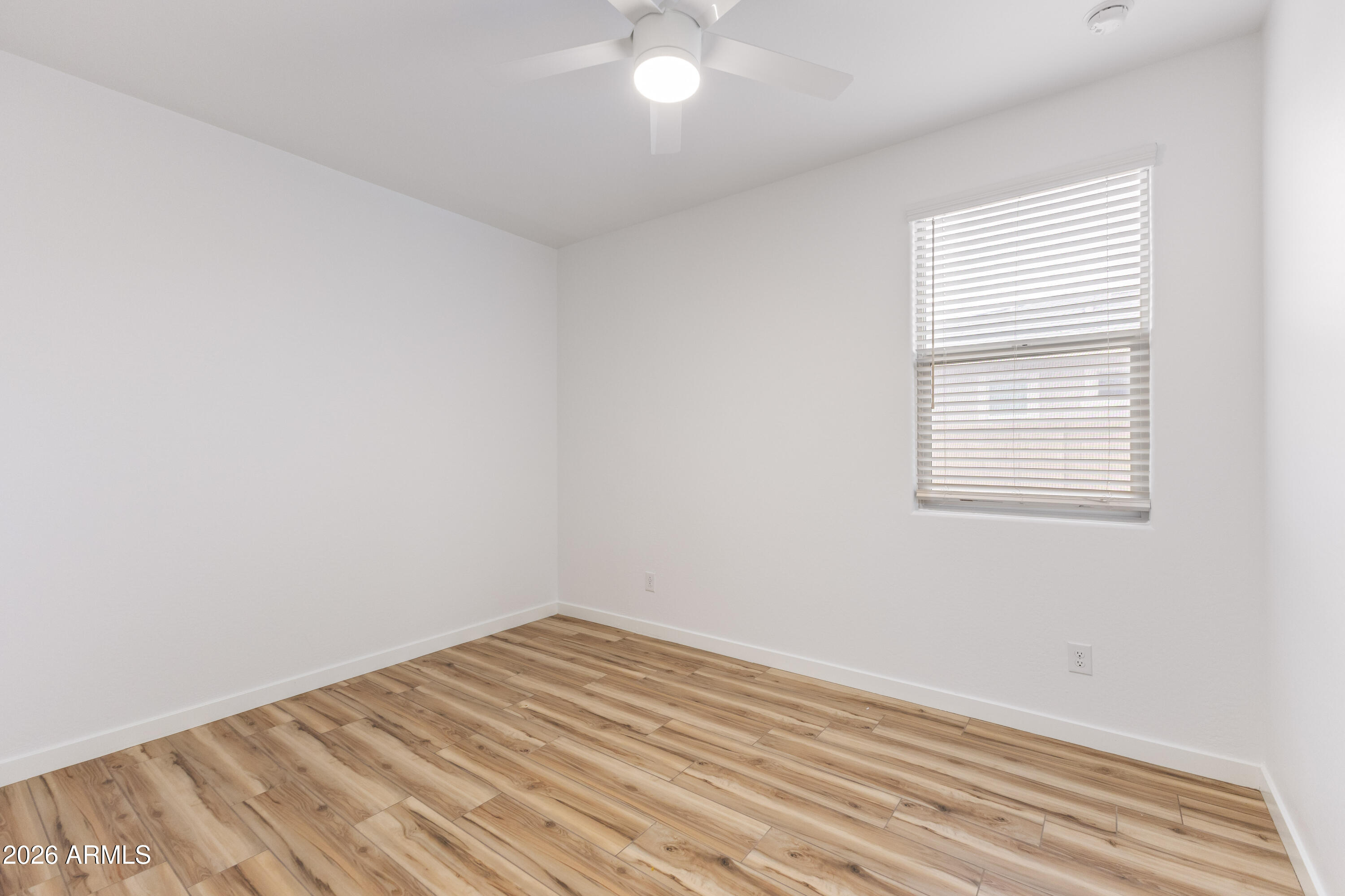 21303 East Estrella Road Queen Creek, AZ 85142 - Photo 24 of 32 an empty room with a window