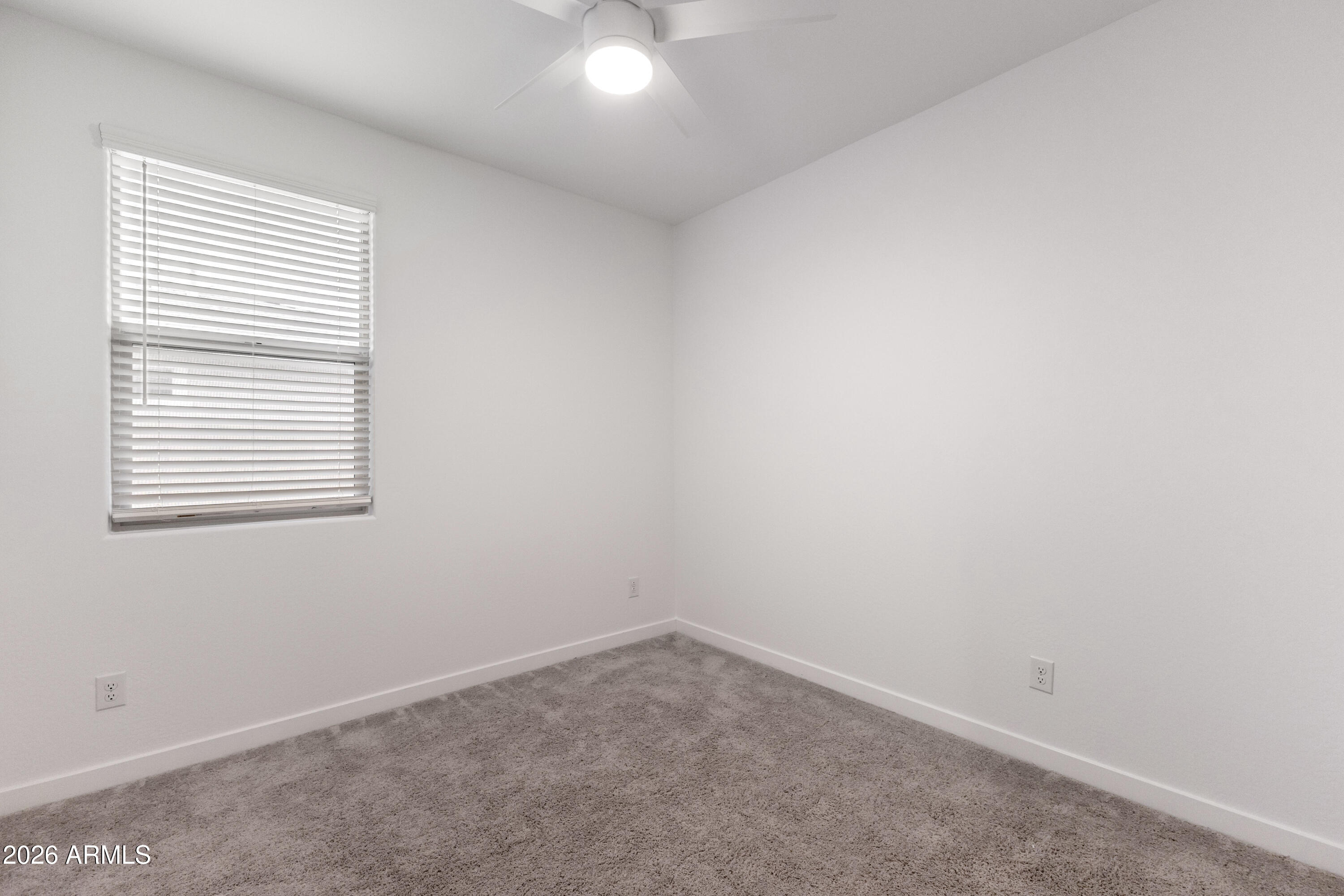 21303 East Estrella Road Queen Creek, AZ 85142 - Photo 25 of 32 an empty room with a window