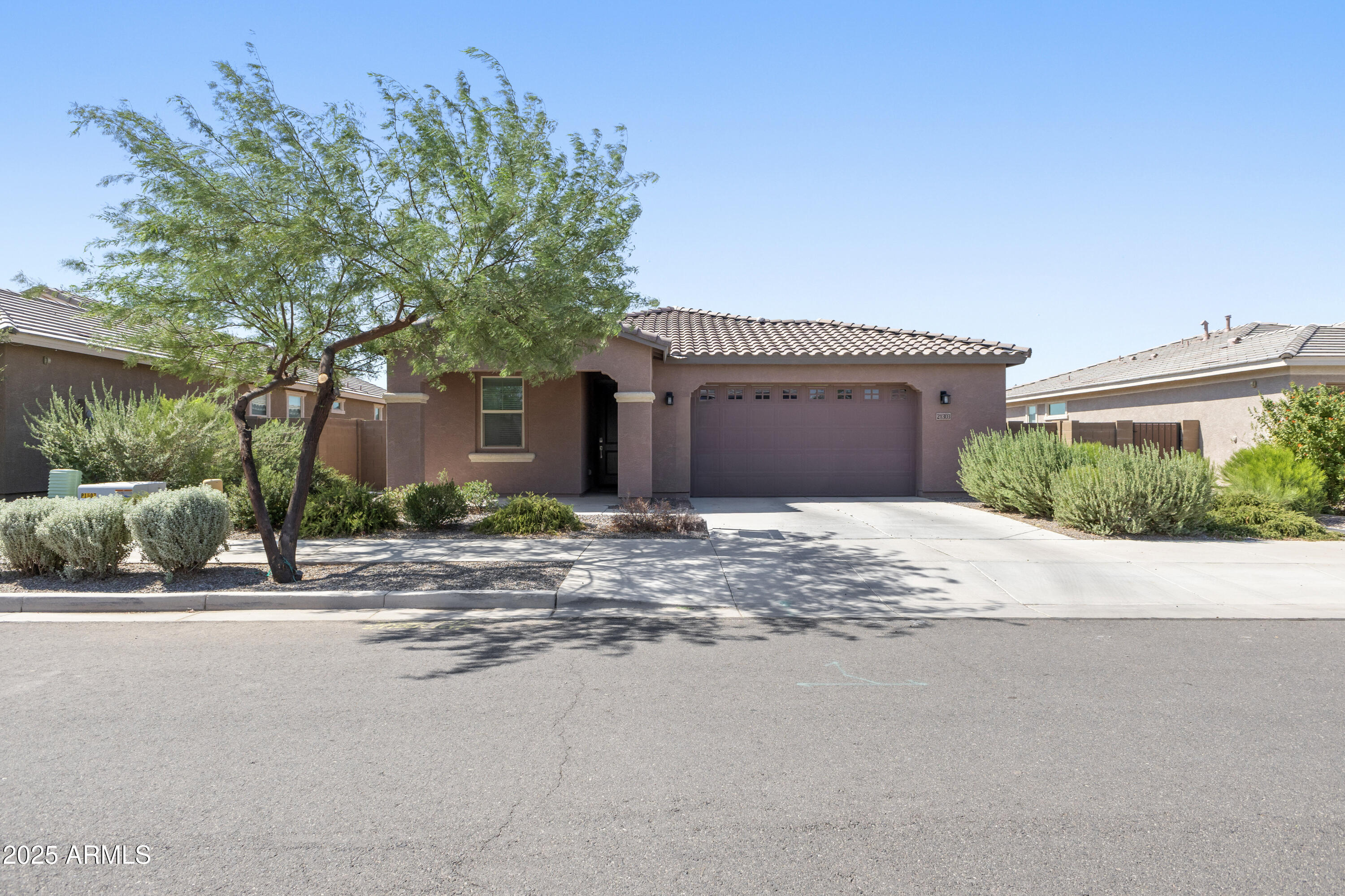 21303 East Estrella Road Queen Creek, AZ 85142 - Photo 3 of 32 front view of a house next to a road