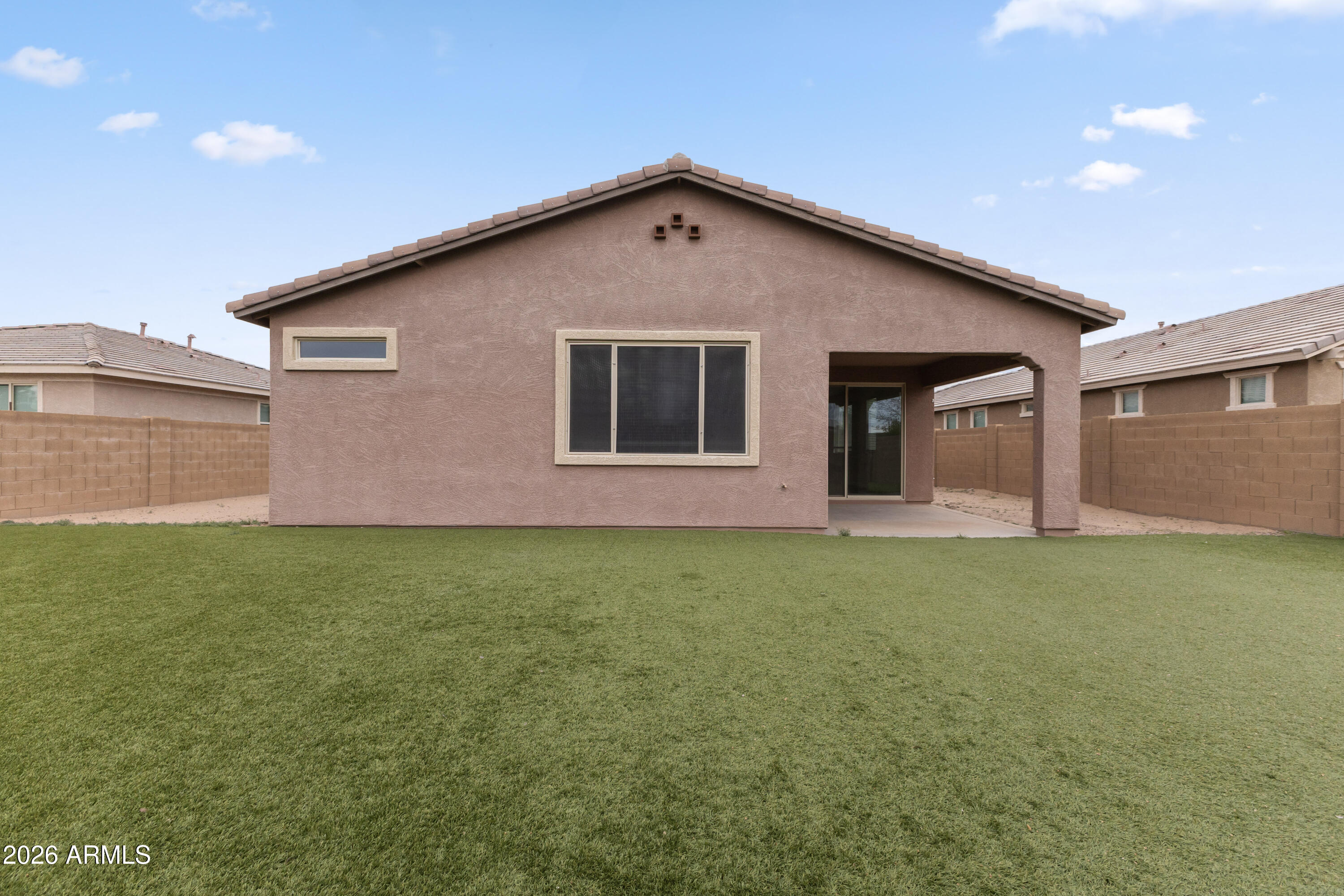 21303 East Estrella Road Queen Creek, AZ 85142 - Photo 31 of 32 a backyard of a house with lots of green space