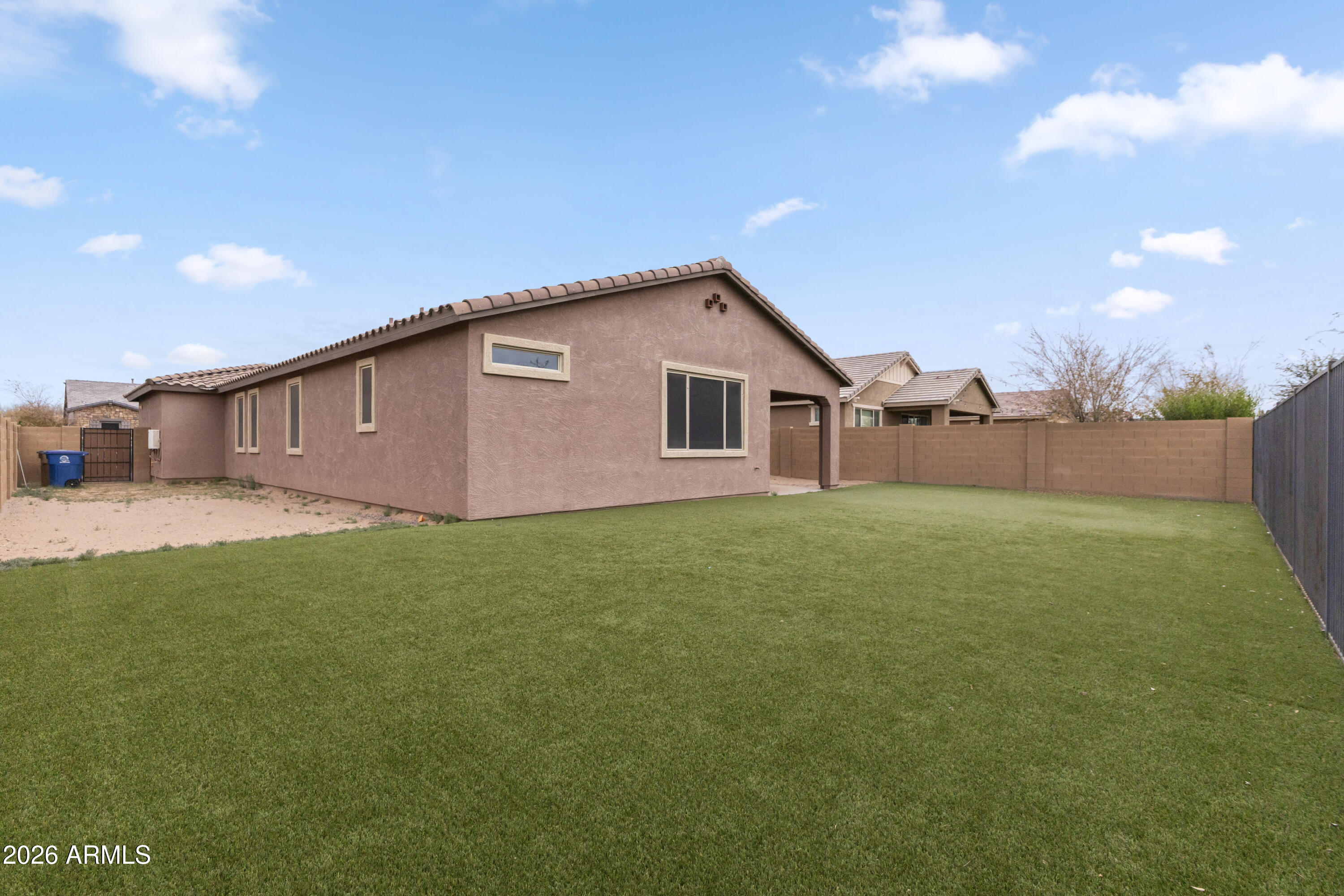 21303 East Estrella Road Queen Creek, AZ 85142 - Photo 32 of 32 a view of a backyard of the house