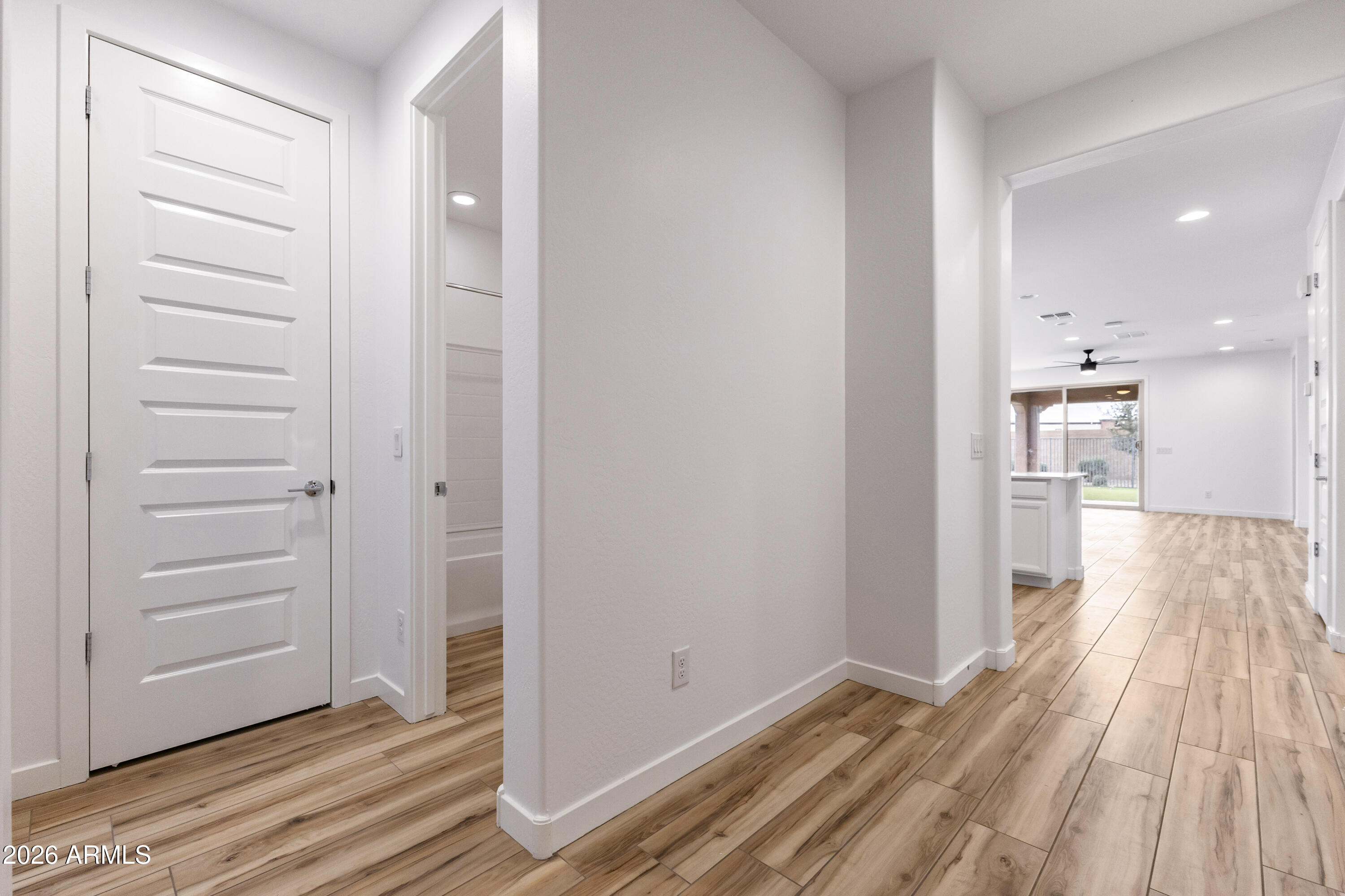 21303 East Estrella Road Queen Creek, AZ 85142 - Photo 6 of 32 a view of a hallway with wooden floor
