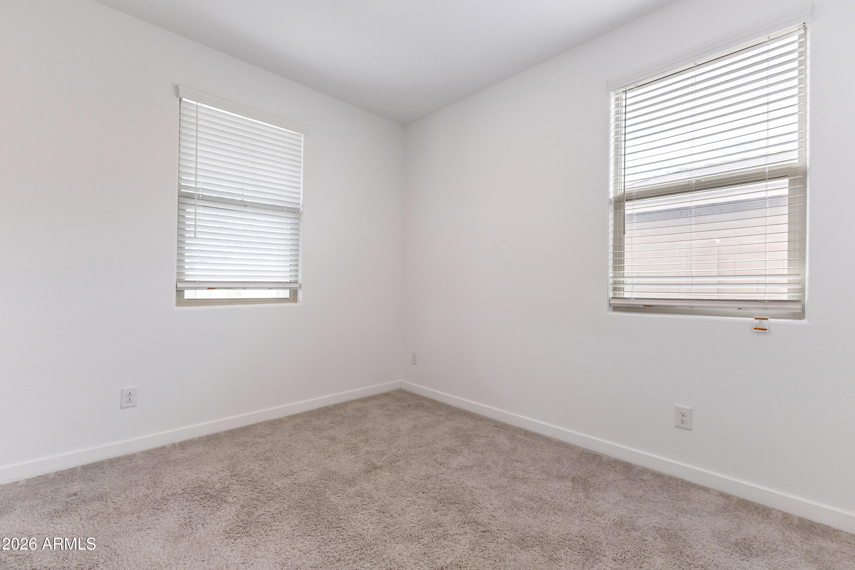 21303 East Estrella Road Queen Creek, AZ 85142 - Photo 7 of 32 an empty room with a window