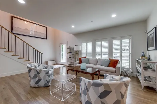 a living room with furniture or couch and a wooden floor