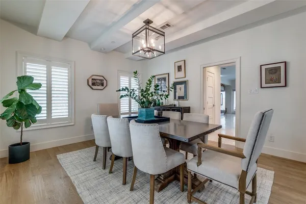 a view of a dining room with furniture and window