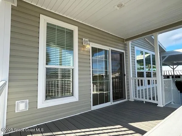 a view of backyard with deck