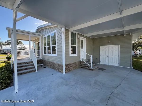 an empty room with furniture and windows