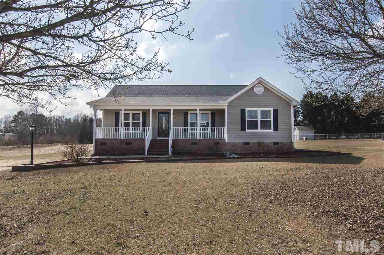 1849 Sanders Road Willow Spring, NC 27592 - Photo 2 of 25 a front view of a house with a yard